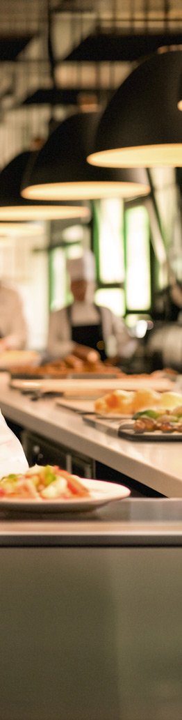 Portion of a photo showing a St Cuthbert's girl as a chef